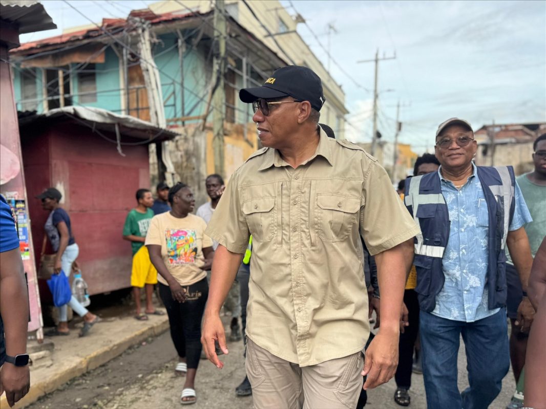 PM Andrew Holness walks through the streets of St. James parish in the of Hurricane Melissa. (AH Photo)