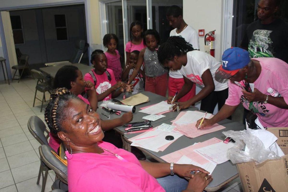 Kufa Cabey photo of the Nurse Brenda Daley (left) at the registration table for the Pink Ribbon Walk held on Saturday, October 29, 2016.