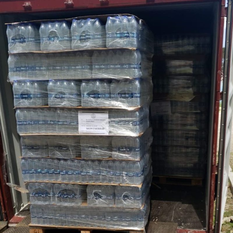 Photos of pallets of water to be shipped to St. Vincent. (Rotary Club Montserrat)