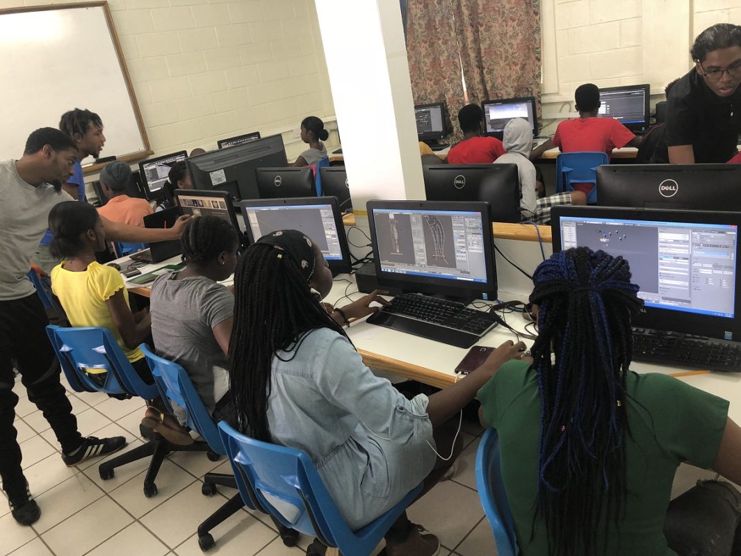 Students are learning how to build their own video game. (4D Photo)