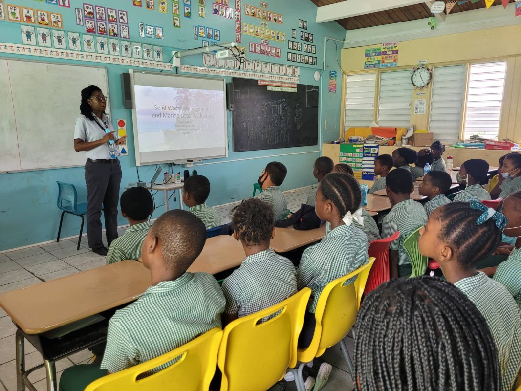 Deidre Allen, Environmental Officer in the Environmental Health Department speaks to students at Brades Primary about protecting the ocean through proper waste management at home.
