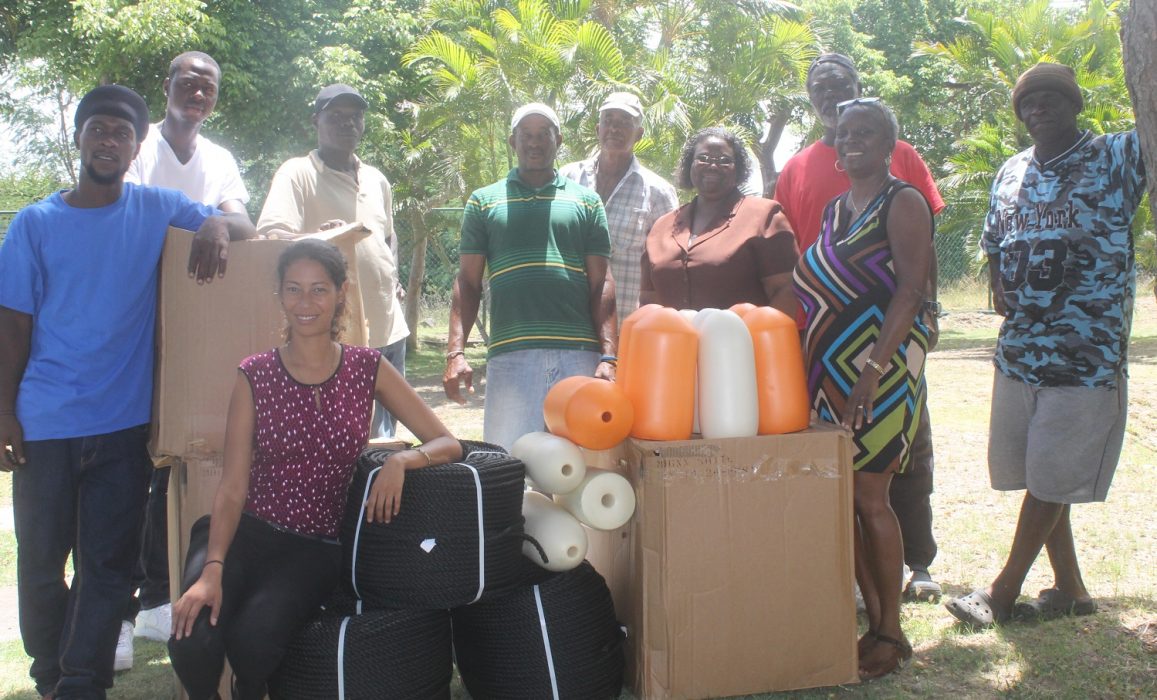 Group Photo of Fishermen, Permanent Secretary (Ag), Eulyn Greaves, WAITT Institute Representative Robin Ramdeen and Director of Agriculture, Melissa O’Garro.  Photo Credit: GIU