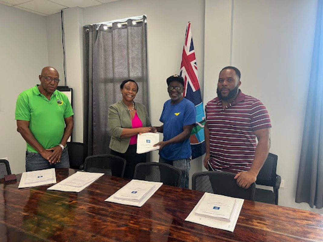 Contract Signing - Phase 1 of Social Housing Units Drummonds (l to r) Franklyn Greenaway, Permanent Secretary Daphne Cassell, Justin Thomas of Steel Express Services and Minister of Housing John Osborne.