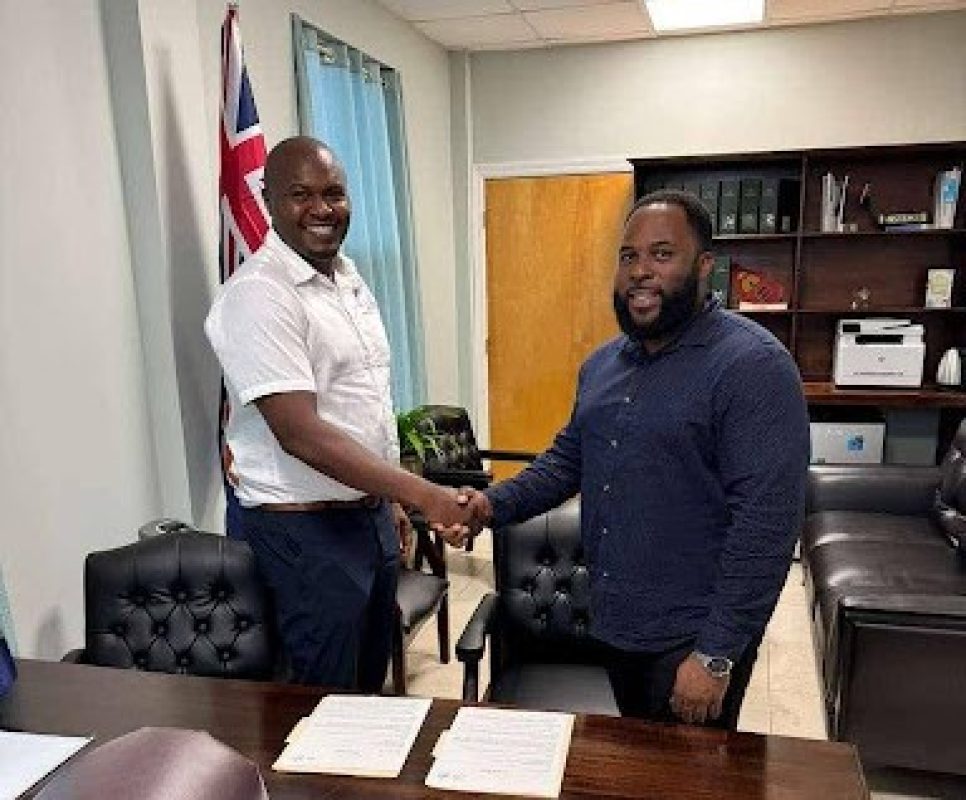 Chief Executive Officer of The Massiah Group, Ryan Massiah with Minister of Agriculture John P Osborne (right)