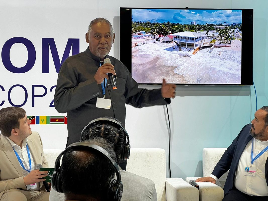 Premier delivering presentation at COP29. (GIU Photo)