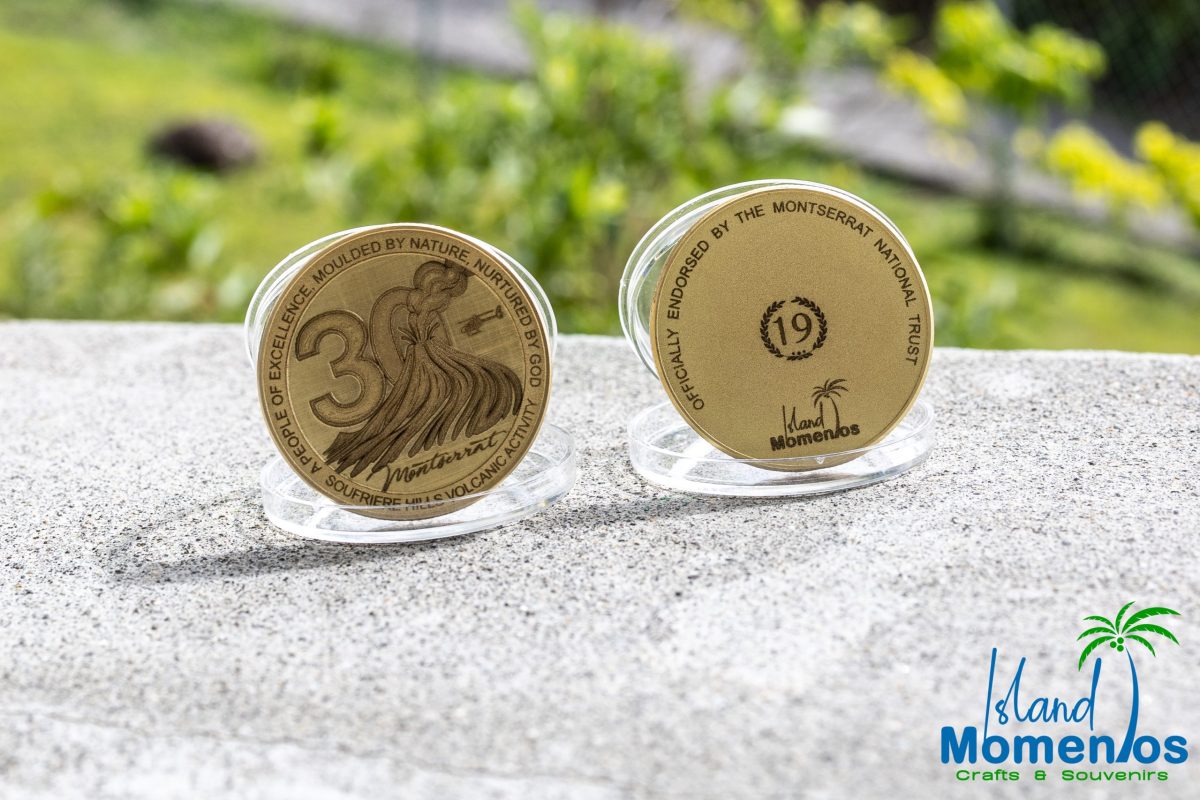 Sample of commemorative coins to mark 30 years since volcanic eruptions restarted at Soufriere Hills Volcano.